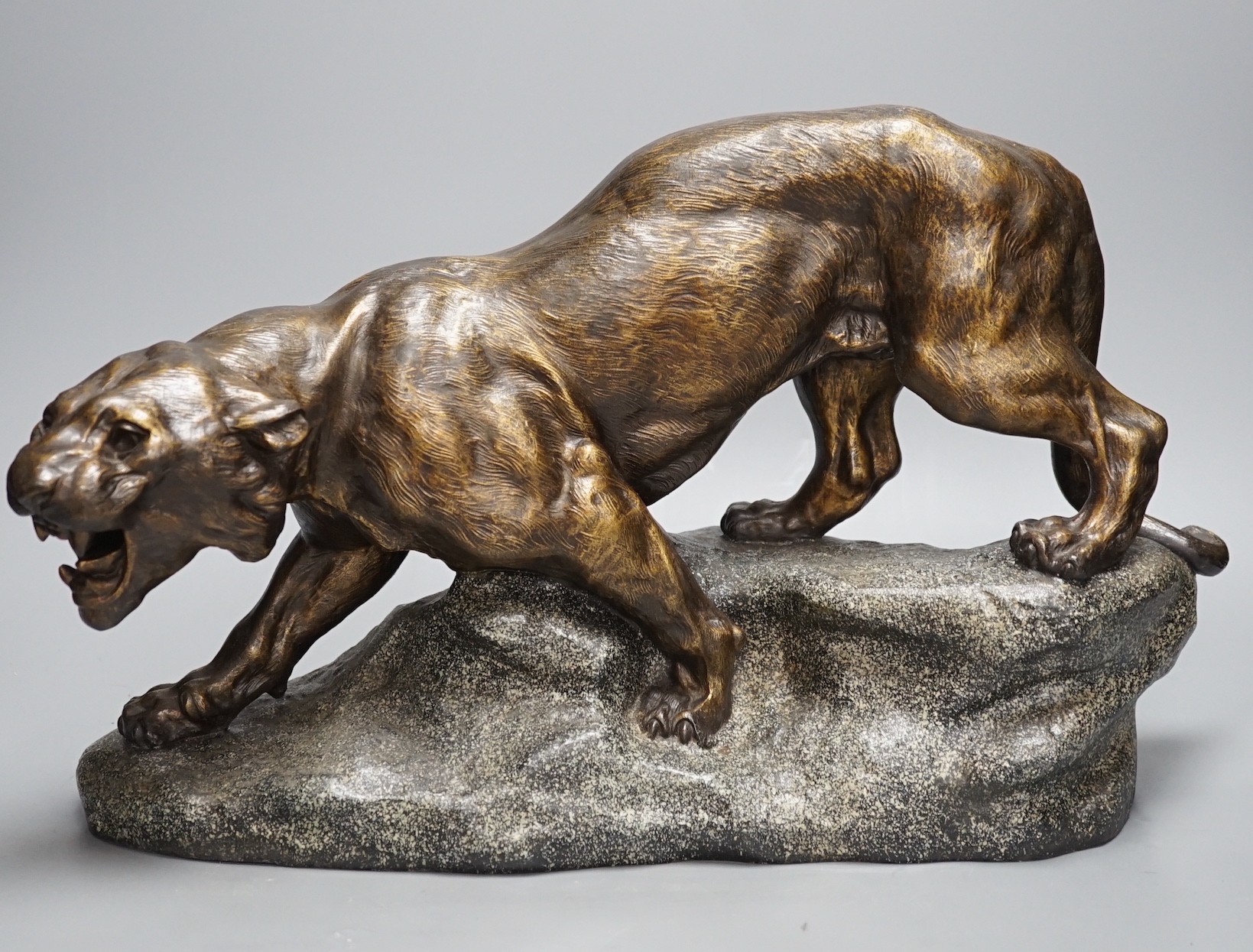 After Thomas François Cartier (1879-1943) patinated spelter model of a tiger 49cm long